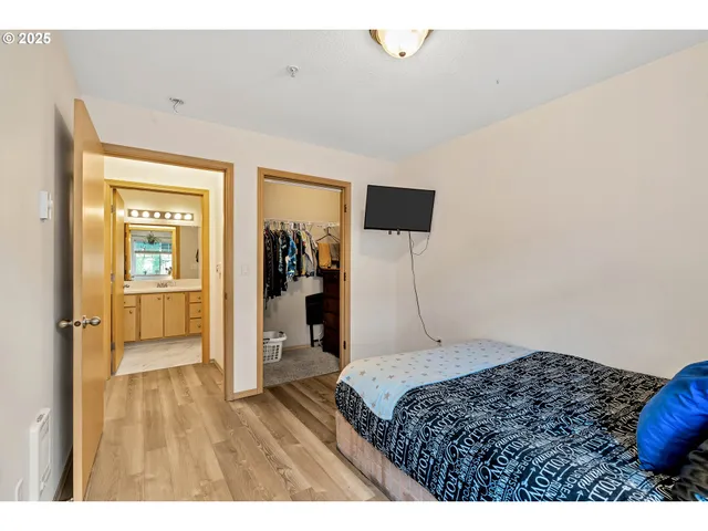 a bedroom with a bed and a view of bathroom