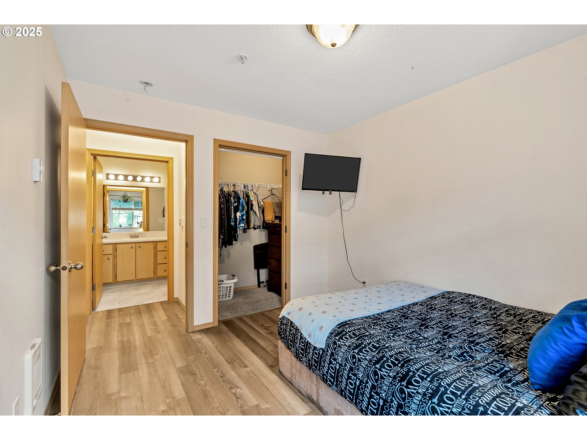 14603 Northeast 20th Avenue, Unit A105 Vancouver, WA 98686 - Photo 16 of 36 a bedroom with a bed and a view of bathroom