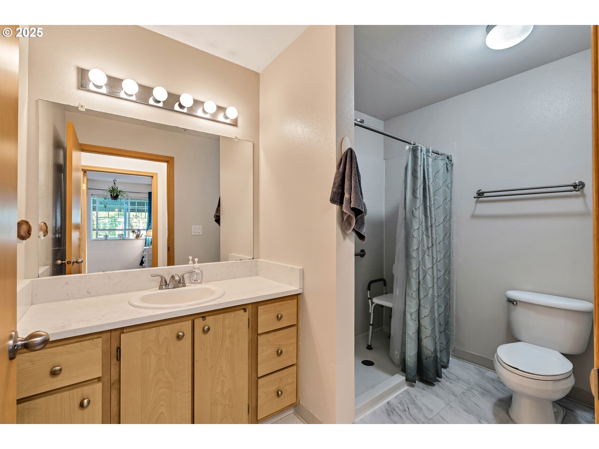 14603 Northeast 20th Avenue, Unit A105 Vancouver, WA 98686 - Photo 17 of 36 a bathroom with a sink a toilet and a mirror