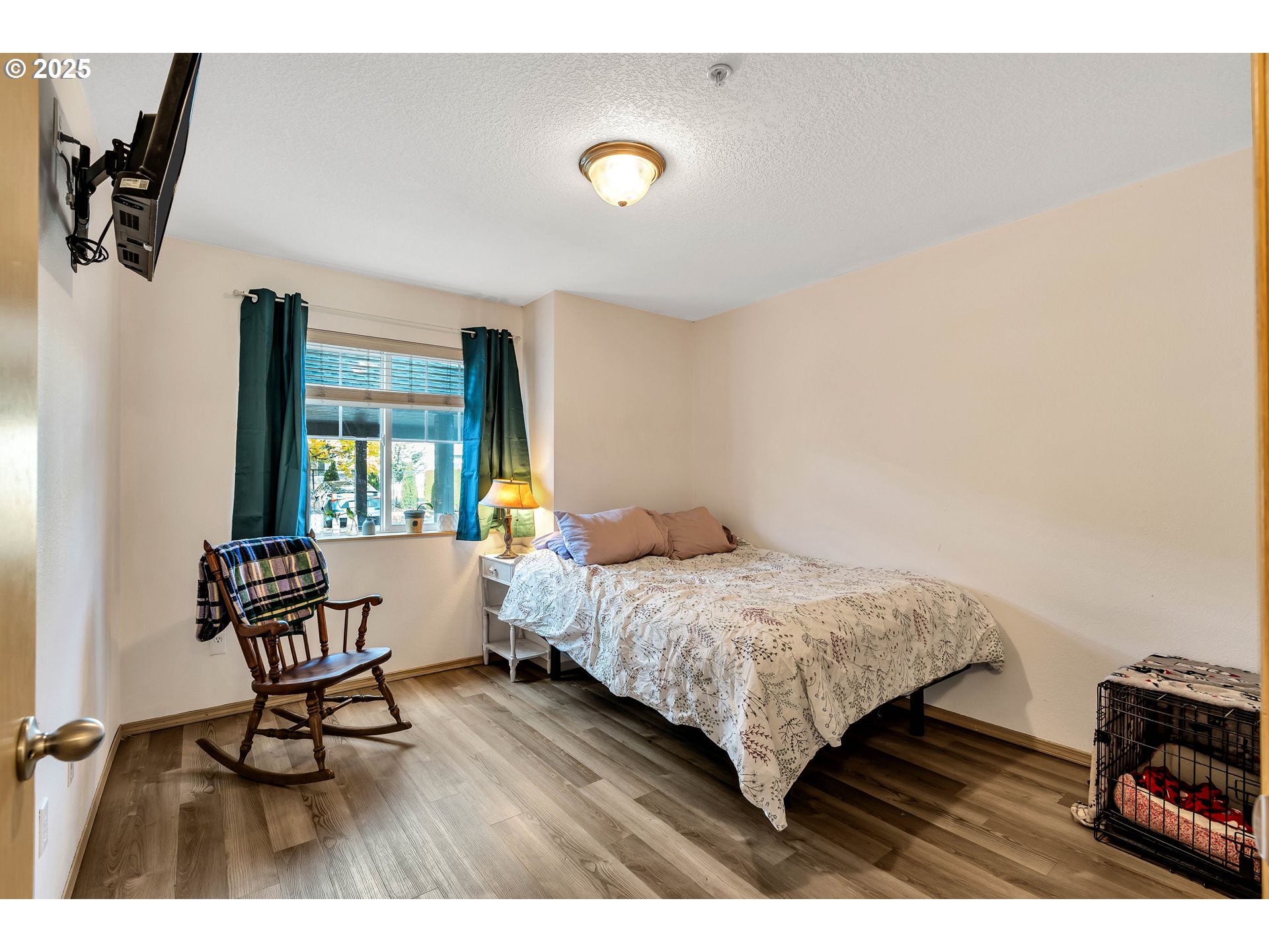 14603 Northeast 20th Avenue, Unit A105 Vancouver, WA 98686 - Photo 19 of 36 a bedroom with a bed and a desk with chair