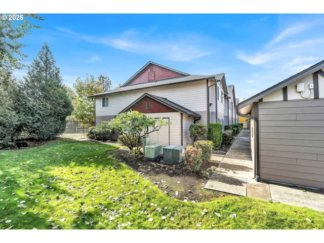 a view of a grassy field with trees