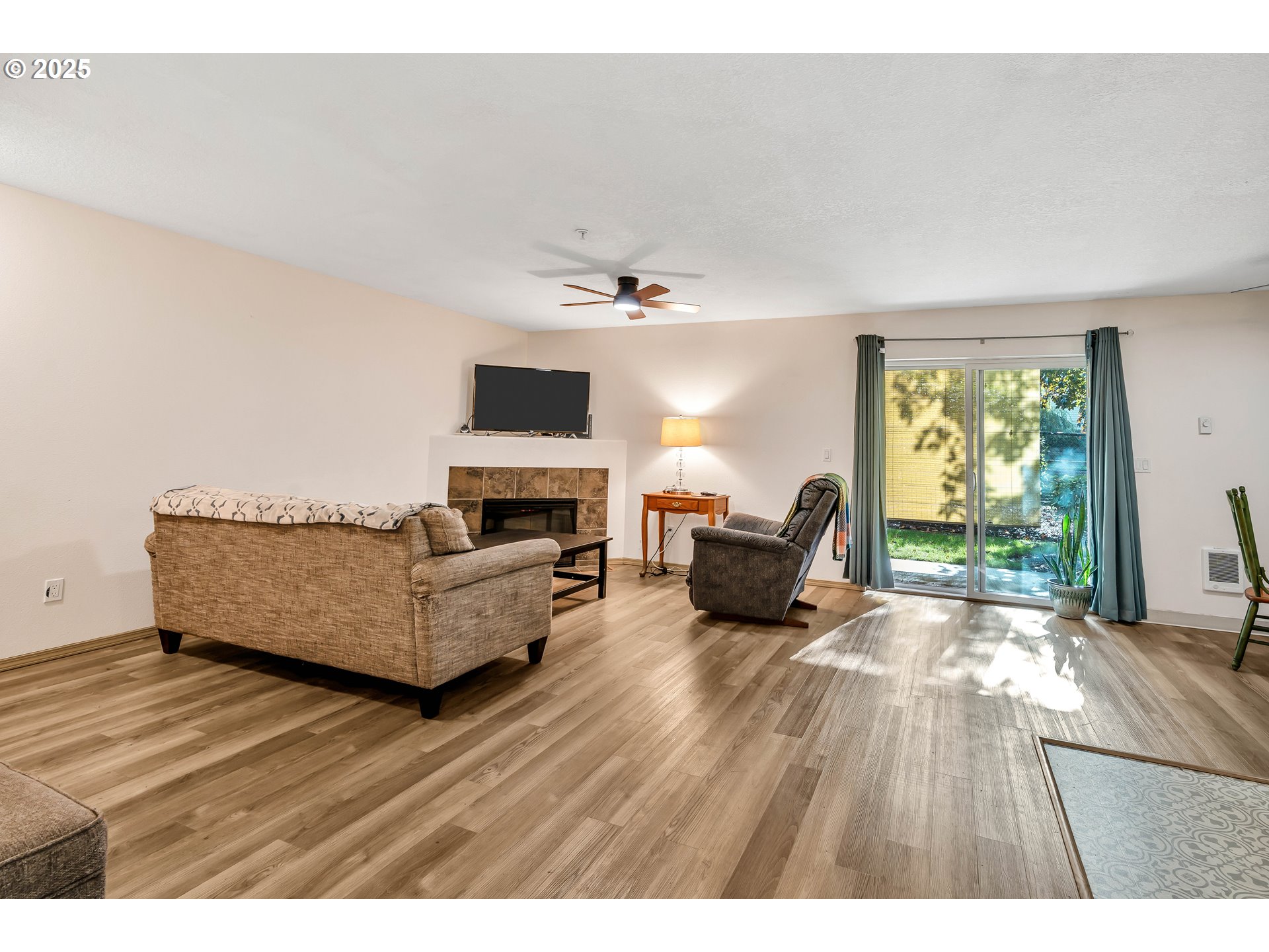 14603 Northeast 20th Avenue, Unit A105 Vancouver, WA 98686 - Photo 8 of 36 a living room with furniture and a fireplace