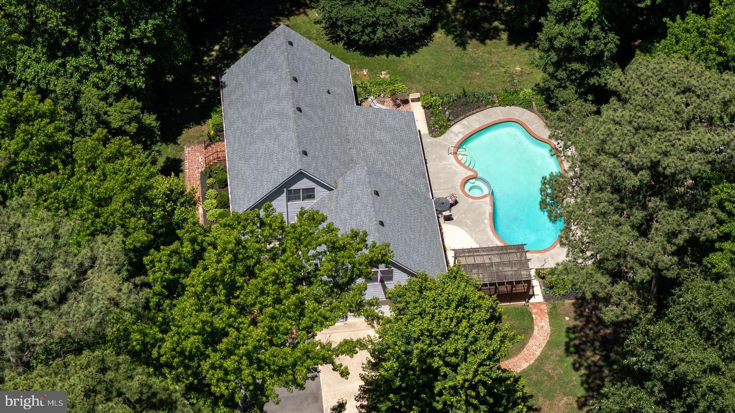 814 Wrights Neck Road Centreville, MD 21617 - Photo 5 of 53 an aerial view of a house with a swimming pool and garden view