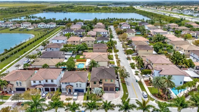 an aerial view of residential building and lake