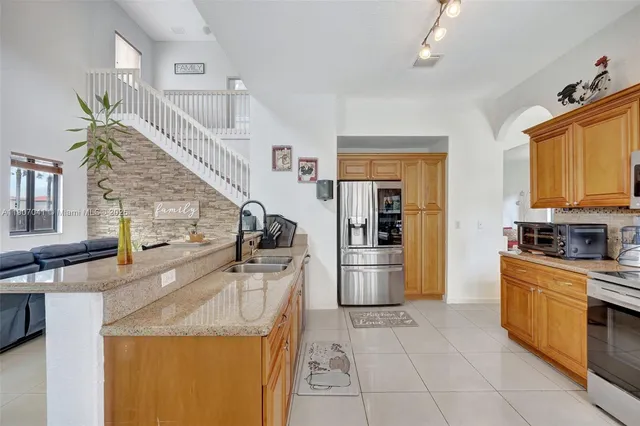 a kitchen with granite countertop lots of counter top space and dining table