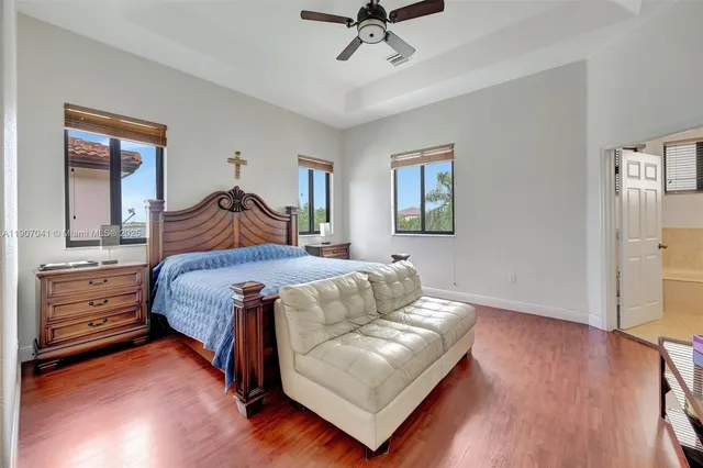 a bed room with a bed and a chandelier