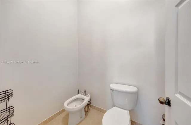 a spacious bathroom with a bathtub sink and mirror