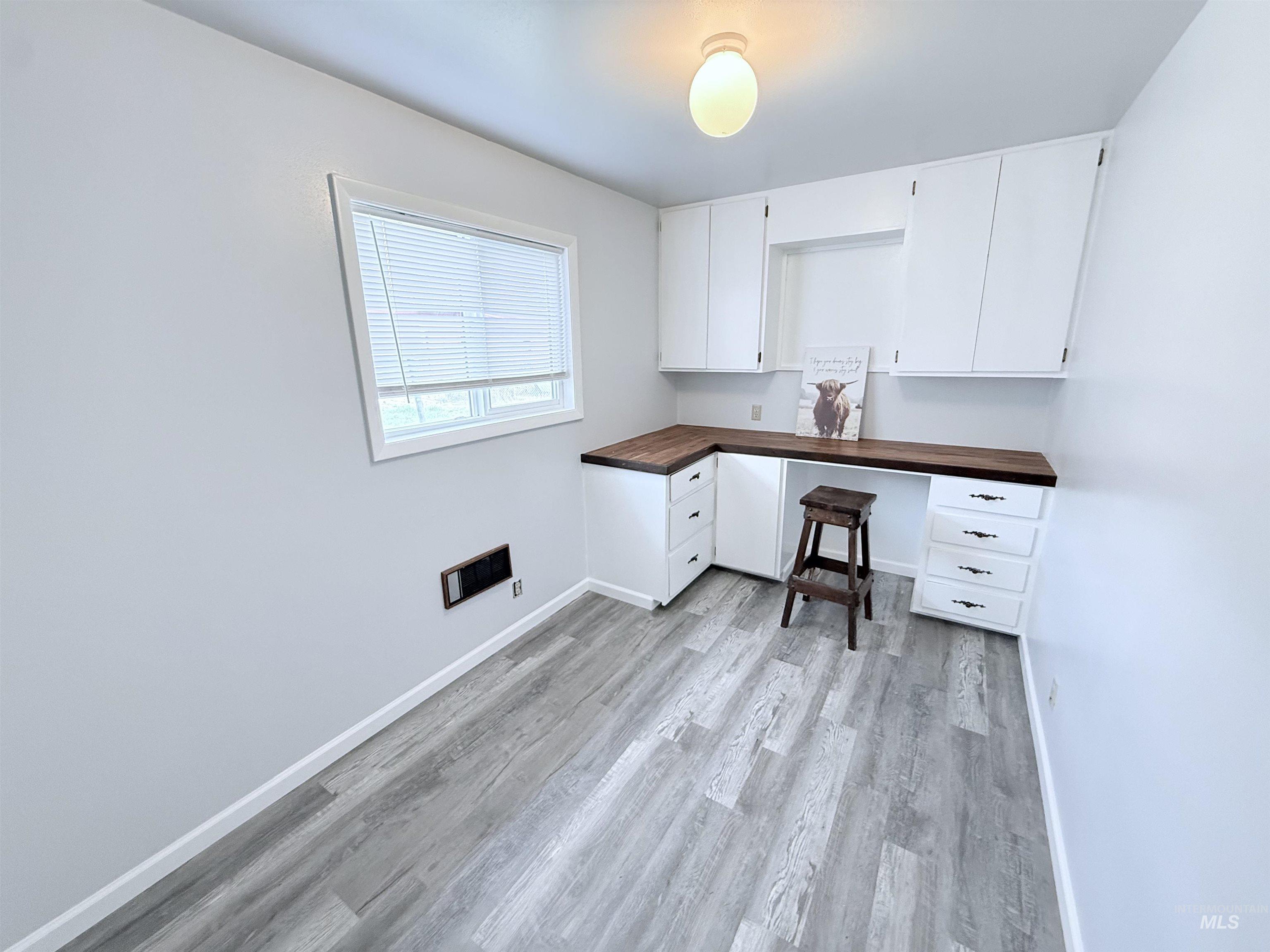 202 East Avenue Wendell, ID 83355 - Photo 18 of 24 Unfurnished office featuring light wood finished floors and built in study area