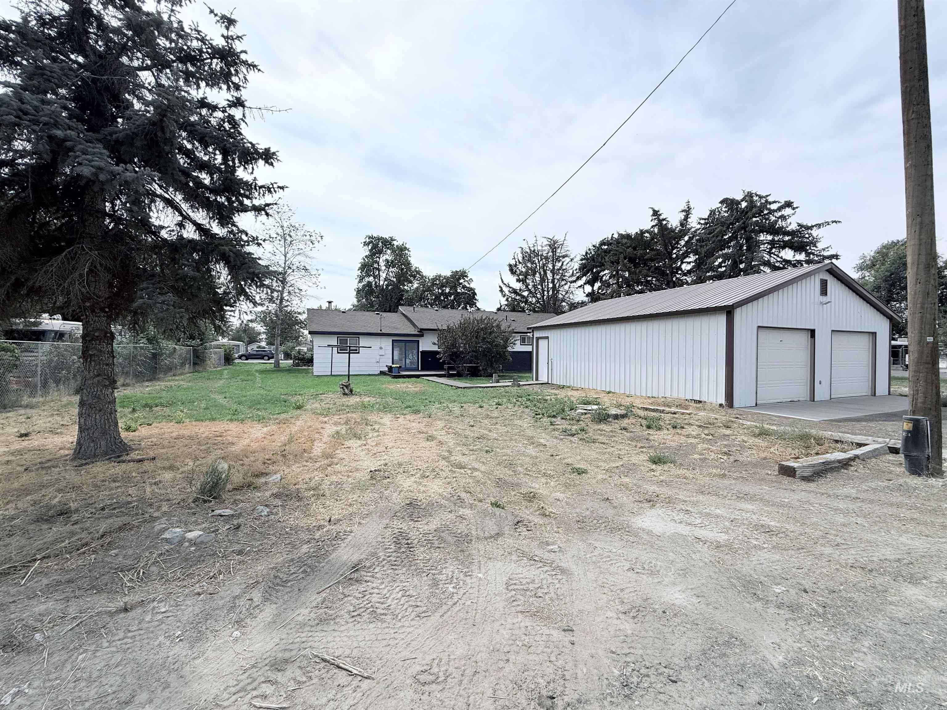 202 East Avenue Wendell, ID 83355 - Photo 22 of 24 View of yard featuring an outdoor structure and a garage