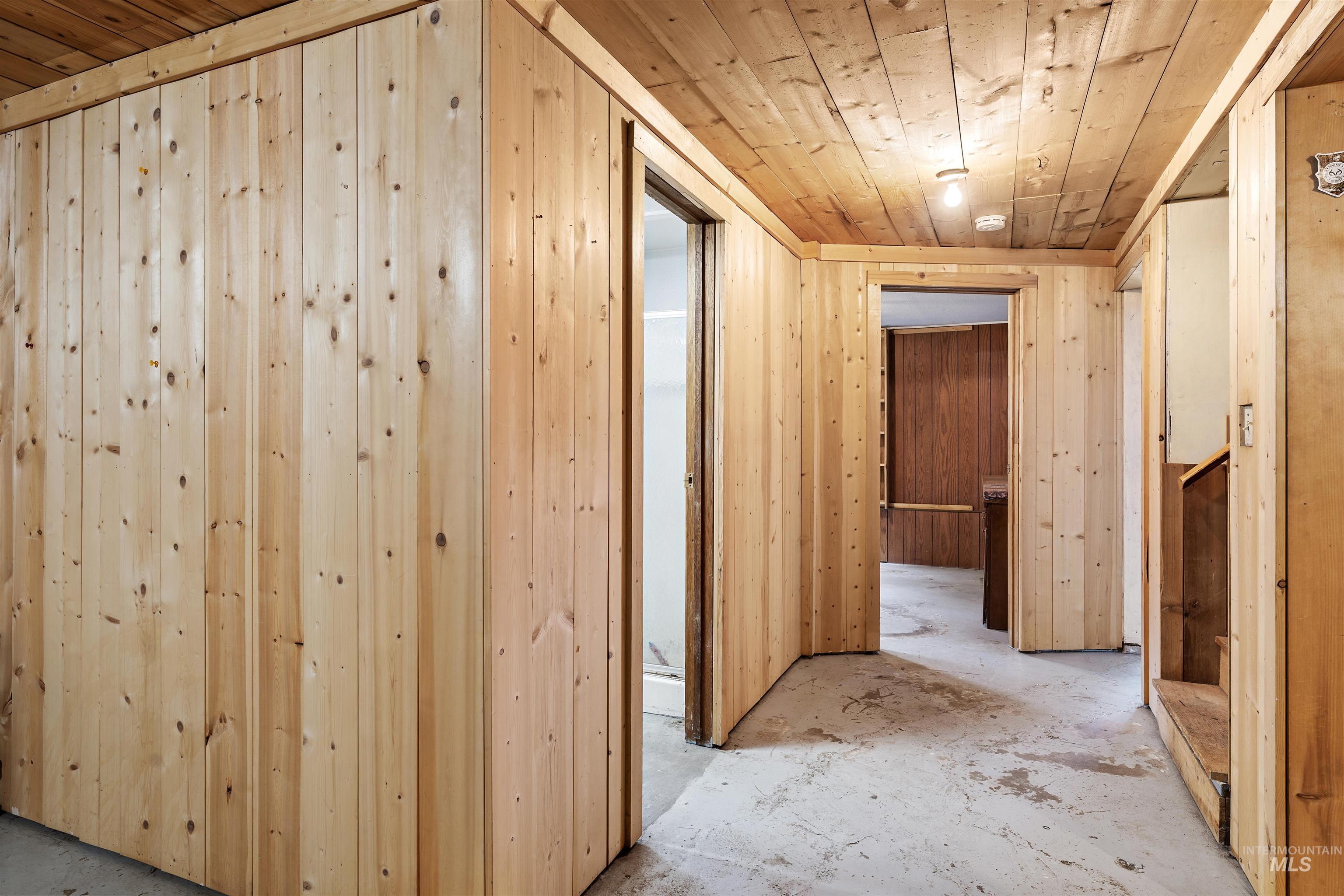 145 Timberline Drive Pierce, ID 83546 - Photo 18 of 39 Wood-paneled walls and ceiling in a neutral finish
