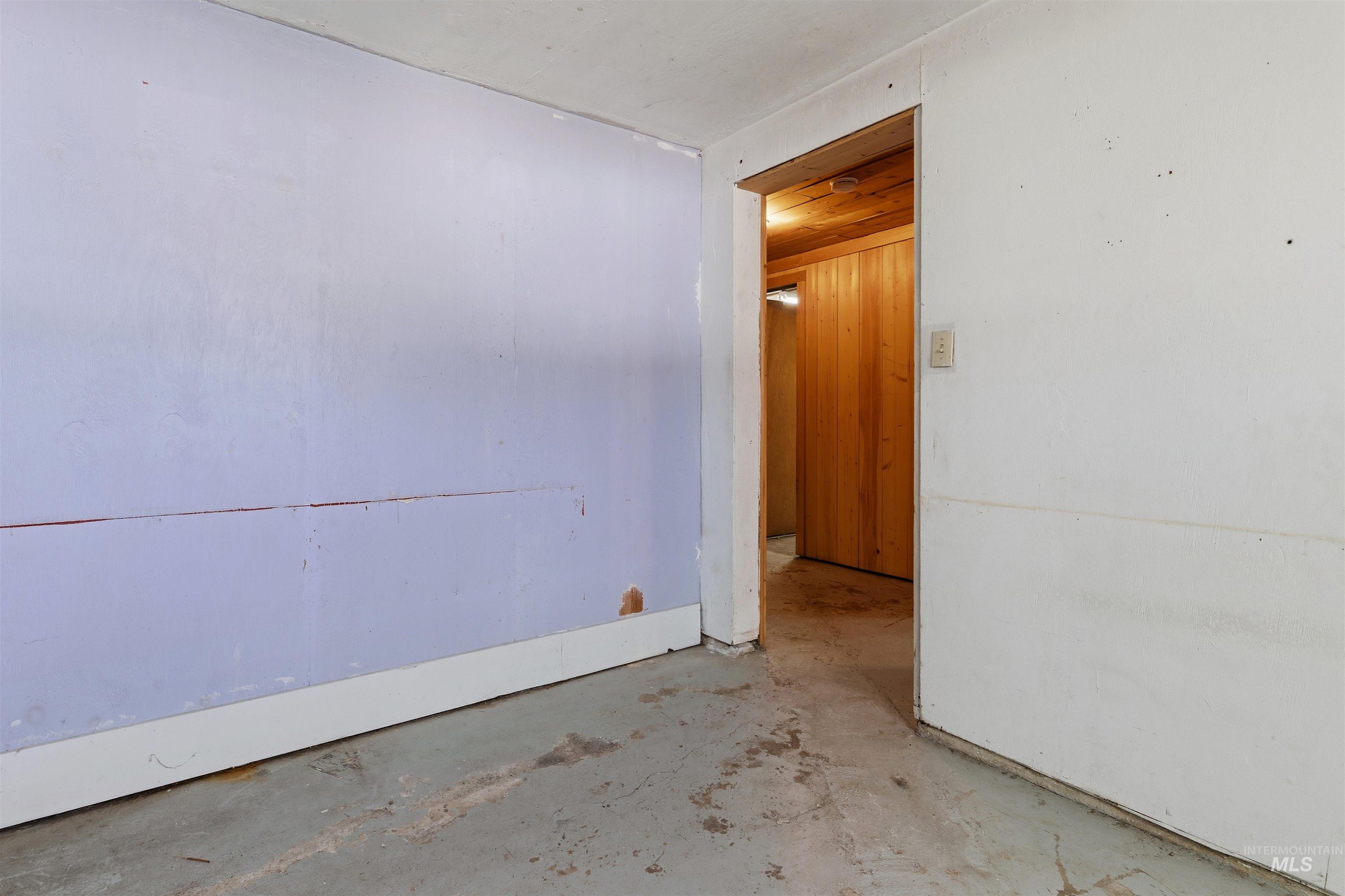 145 Timberline Drive Pierce, ID 83546 - Photo 31 of 39 Unfinished interior space featuring a concrete floor and painted walls
