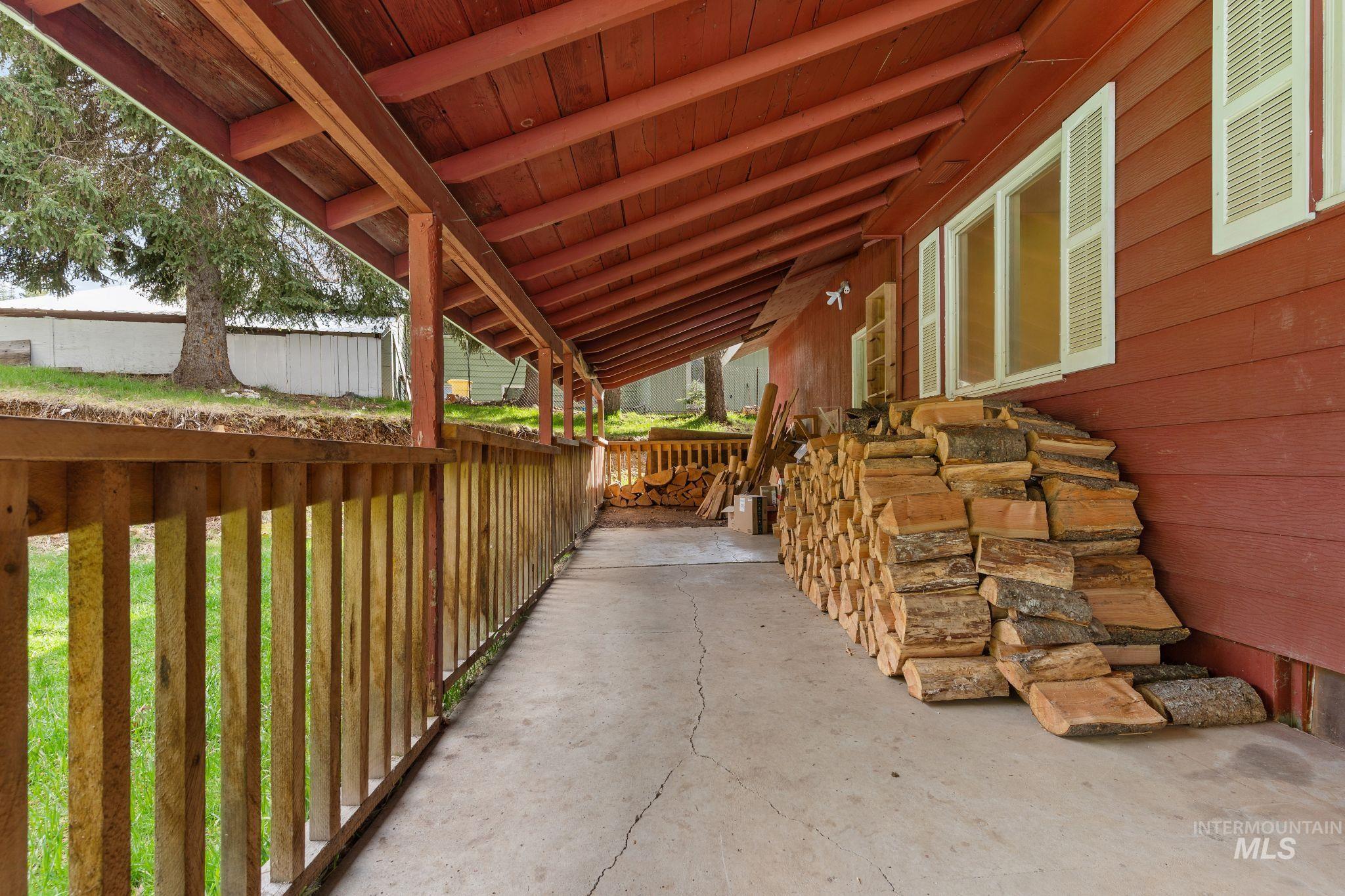 145 Timberline Drive Pierce, ID 83546 - Photo 39 of 39 Covered deck with concrete flooring and wood railing