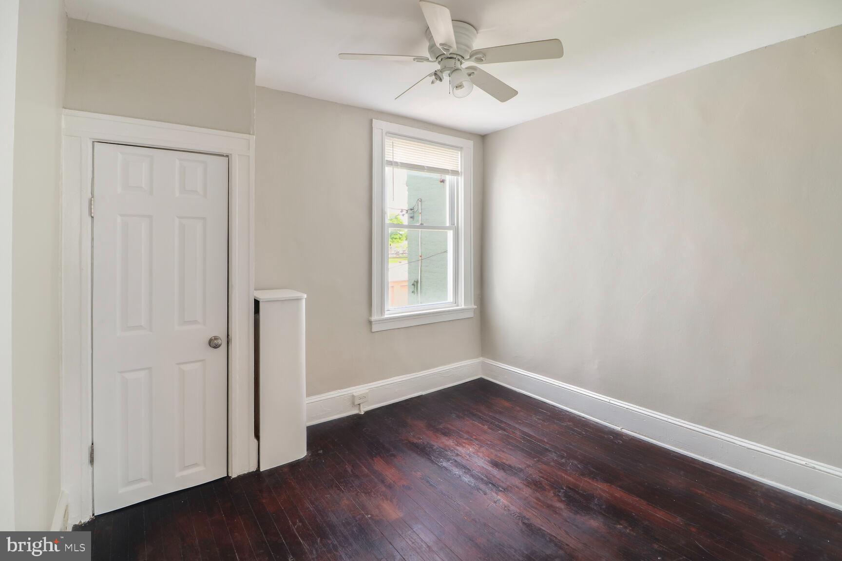 4122 Eierman Avenue Baltimore, MD 21206 - Photo 6 of 13 a view of an empty room with wooden floor