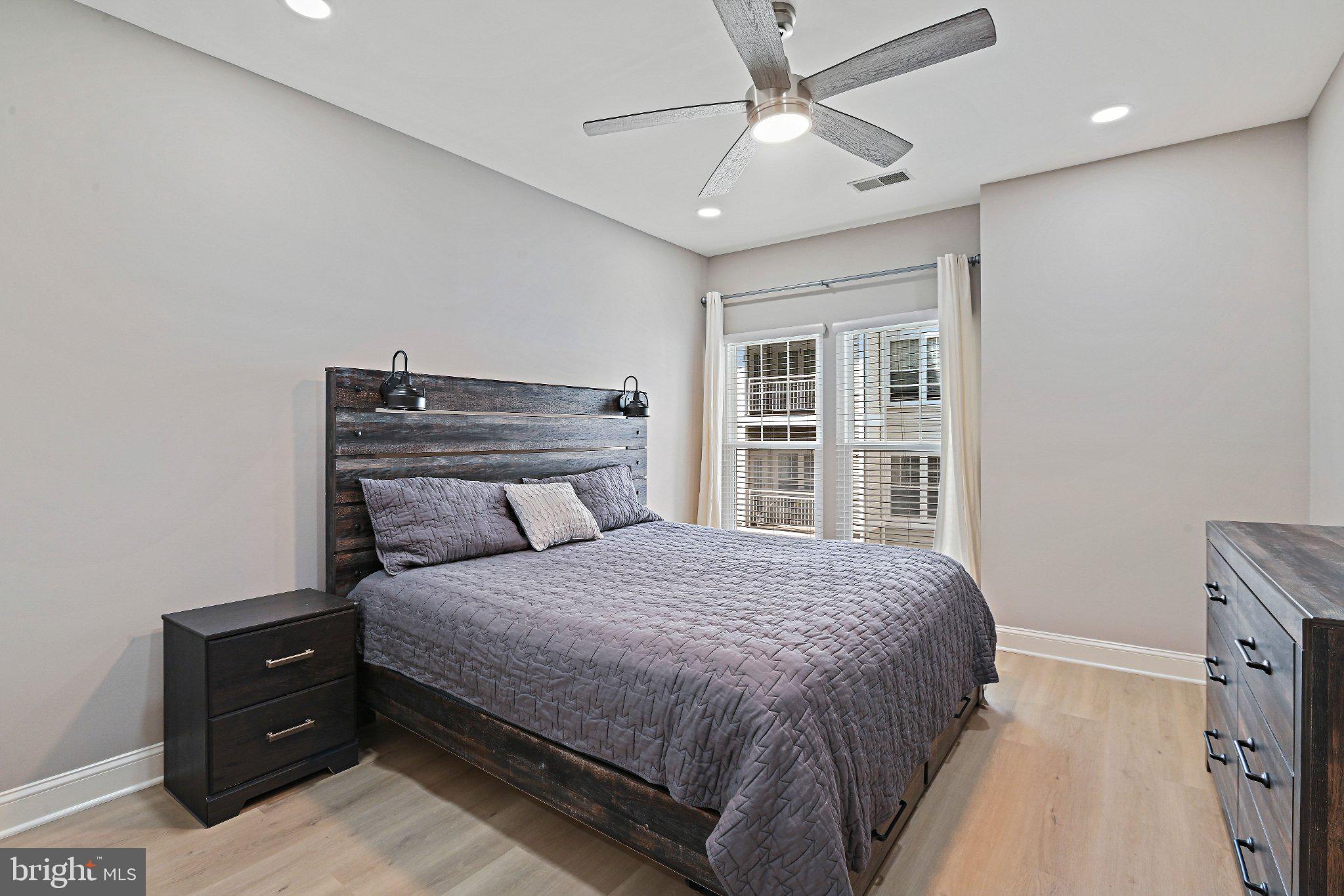 1519 North Point Drive, Unit 202 Reston, VA 20194 - Photo 30 of 49 Modern bedroom with natural light.