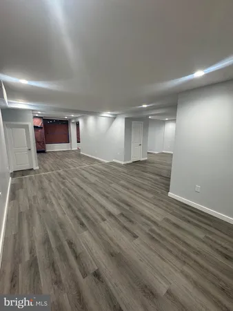 a view of an entryway with wooden floor
