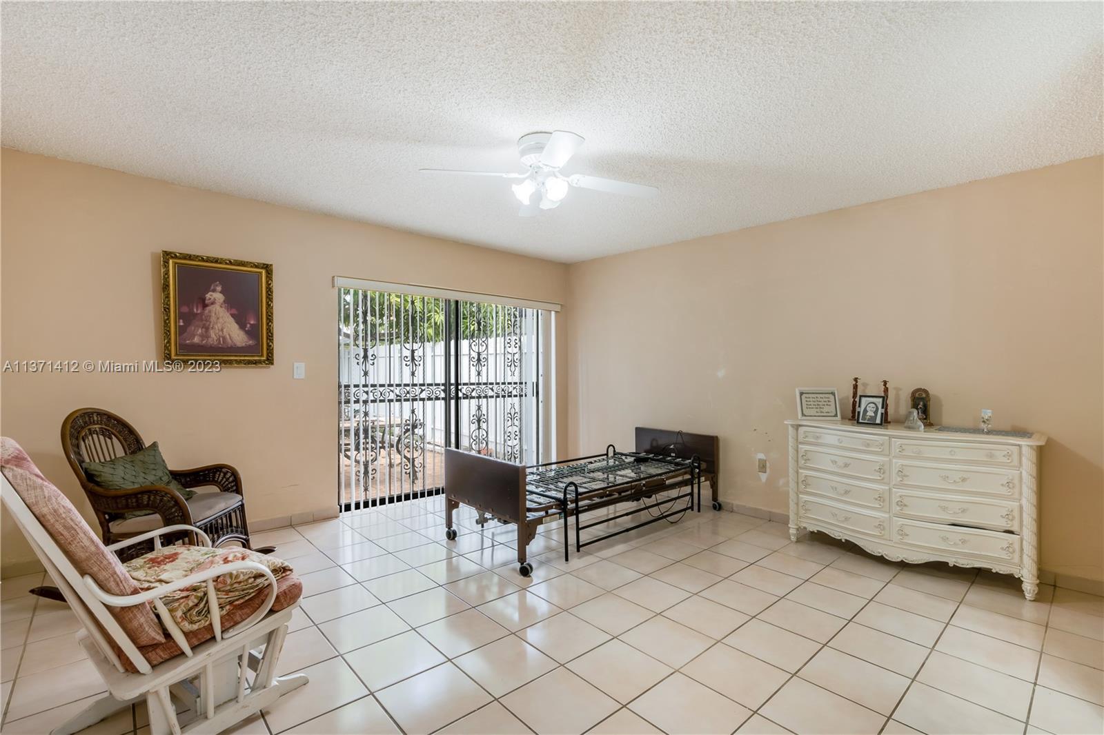 13817 Southwest 21st Terrace Miami, FL 33175 - Photo 21 of 37 a bedroom with furniture and windows