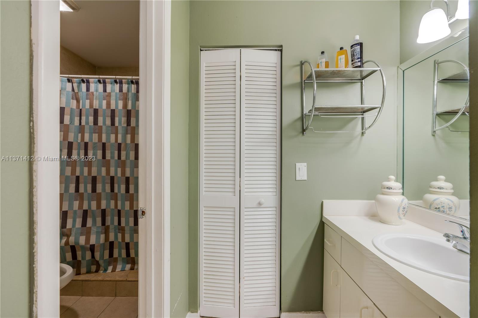 13817 Southwest 21st Terrace Miami, FL 33175 - Photo 23 of 37 a bathroom with a sink and a mirror