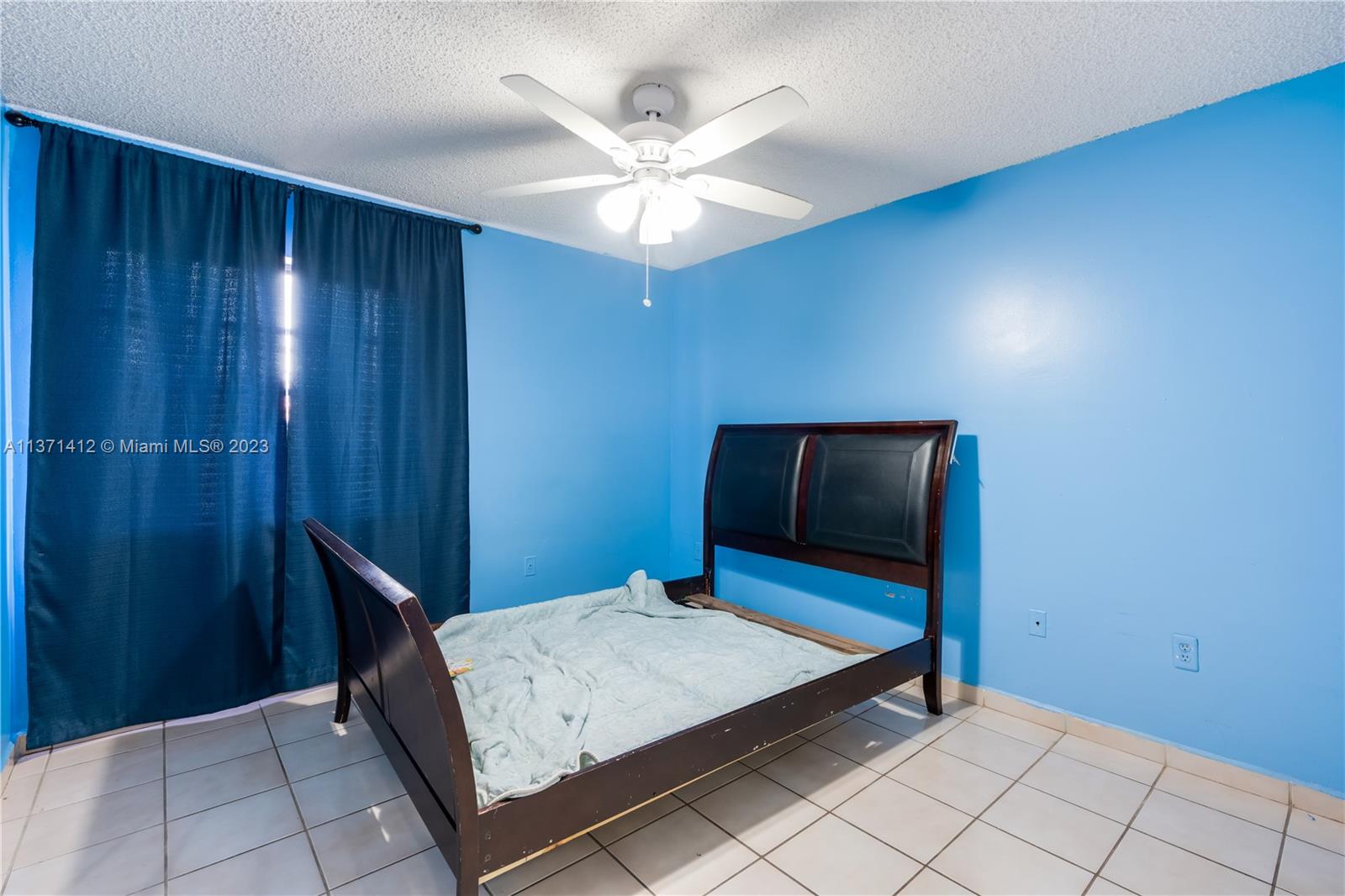 13817 Southwest 21st Terrace Miami, FL 33175 - Photo 27 of 37 a living room with pool table and ceiling fan