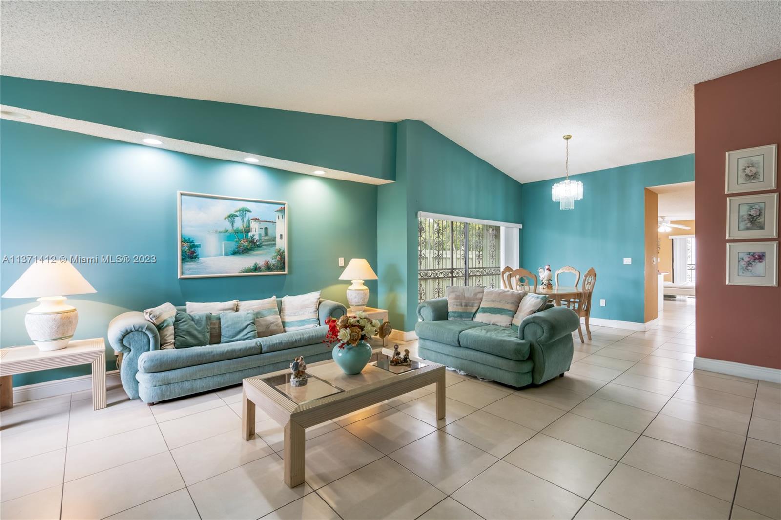 13817 Southwest 21st Terrace Miami, FL 33175 - Photo 4 of 37 a living room with furniture and a potted plant