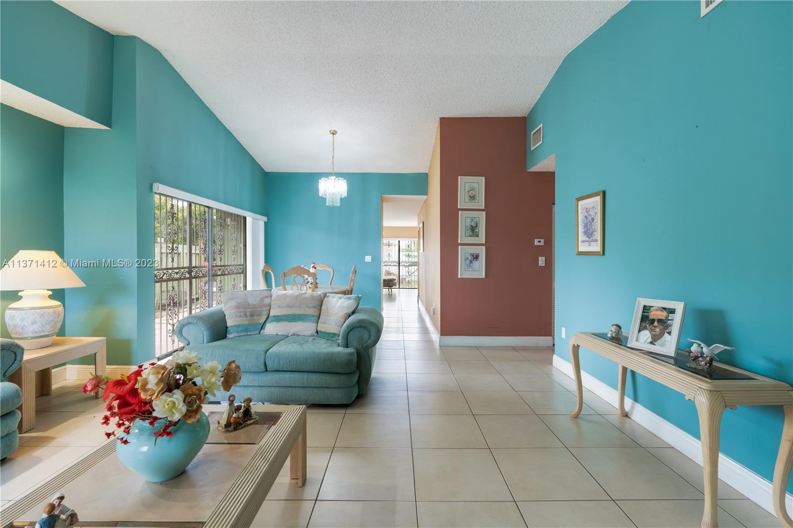 13817 Southwest 21st Terrace Miami, FL 33175 - Photo 5 of 37 a living room with furniture and a wooden floor