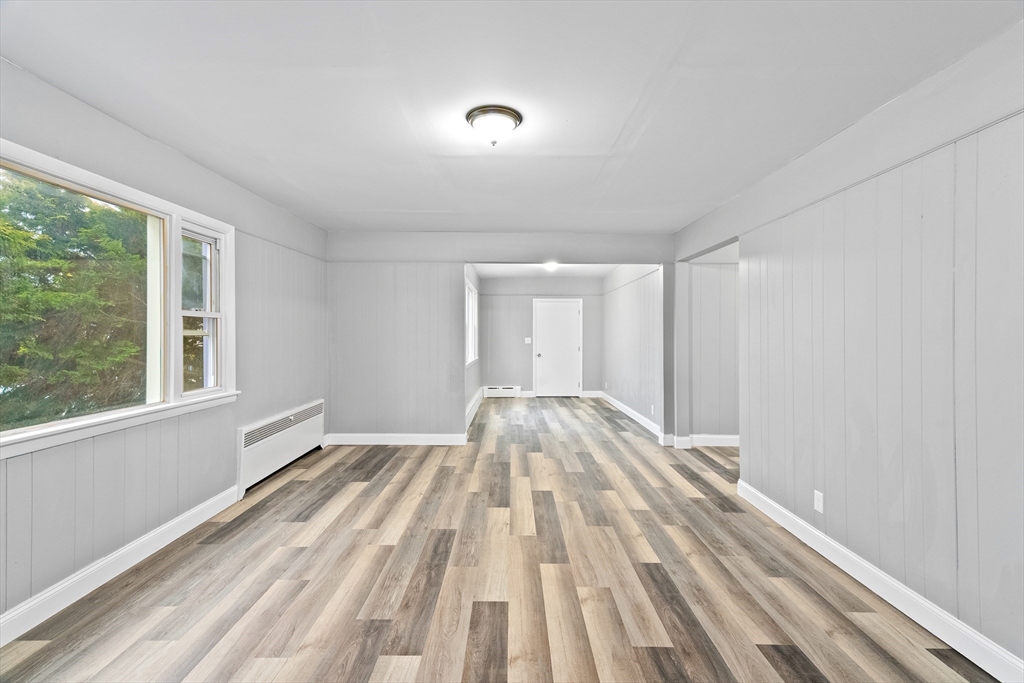 1039 South Main Street Fall River, MA 02724 - Photo 13 of 39 a view of empty room with wooden floor and fan