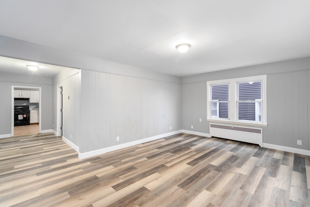 1039 South Main Street Fall River, MA 02724 - Photo 14 of 39 a view of empty room with wooden floor and fan