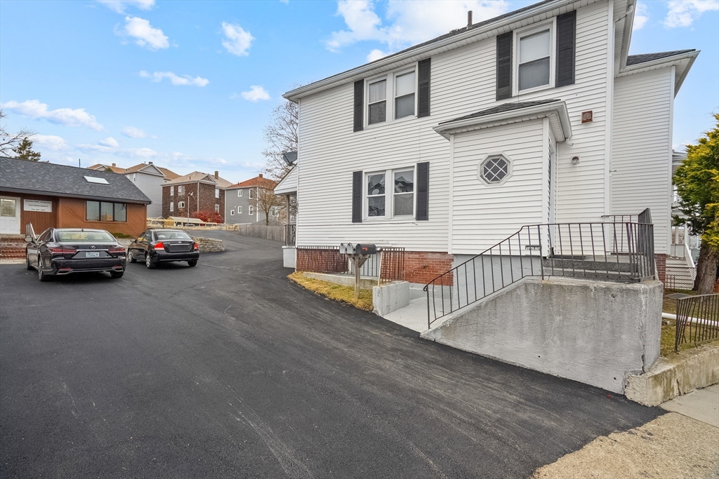 1039 South Main Street Fall River, MA 02724 - Photo 2 of 39 a cars parked in front of a house