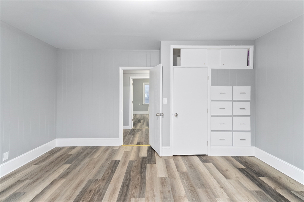 1039 South Main Street Fall River, MA 02724 - Photo 21 of 39 wooden floor in an empty room