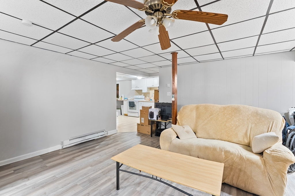 1039 South Main Street Fall River, MA 02724 - Photo 25 of 39 a living room with furniture and a wooden floor