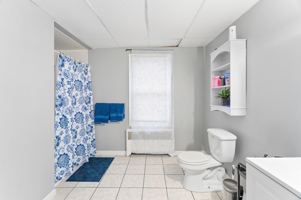 1039 South Main Street Fall River, MA 02724 - Photo 29 of 39 a bathroom with a sink toilet and shower
