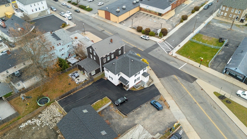 1039 South Main Street Fall River, MA 02724 - Photo 33 of 39 an aerial view of a house with a swimming pool