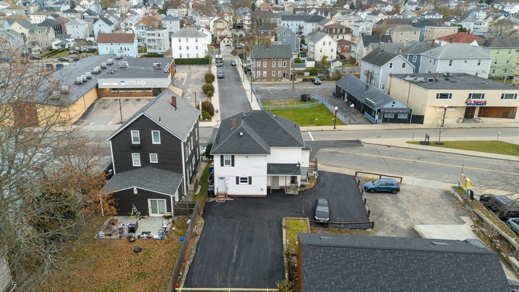 1039 South Main Street Fall River, MA 02724 - Photo 4 of 39 an aerial view of residential houses with outdoor space