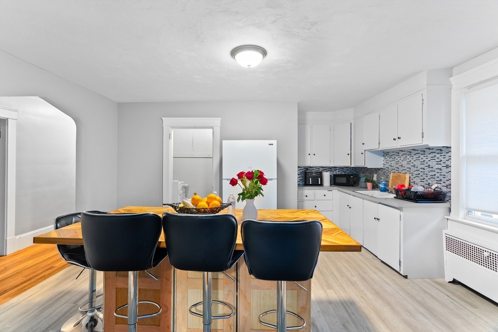 1039 South Main Street Fall River, MA 02724 - Photo 5 of 39 a view of a dining room with furniture and wooden floor