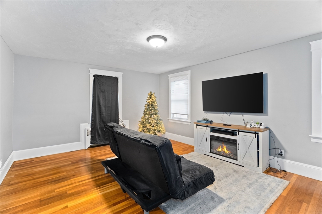 1039 South Main Street Fall River, MA 02724 - Photo 6 of 39 a living room with furniture and a flat screen tv