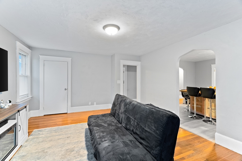1039 South Main Street Fall River, MA 02724 - Photo 7 of 39 a living room with furniture and a flat screen tv