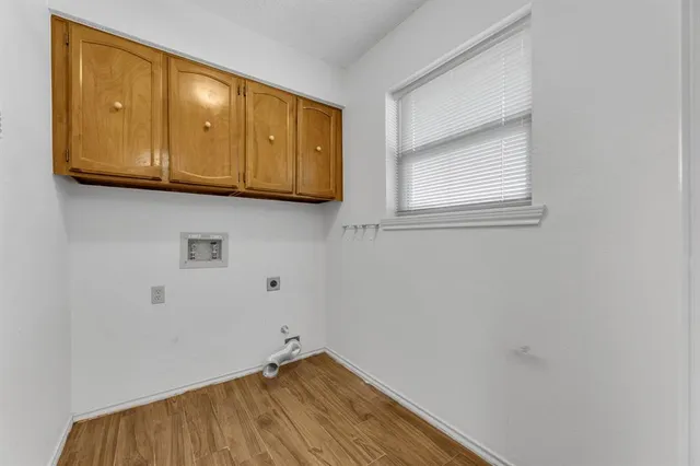 a view of room with wooden floor