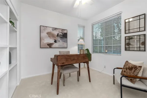 a workspace with furniture and a window