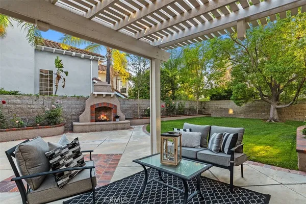a view of a patio with a table and chairs