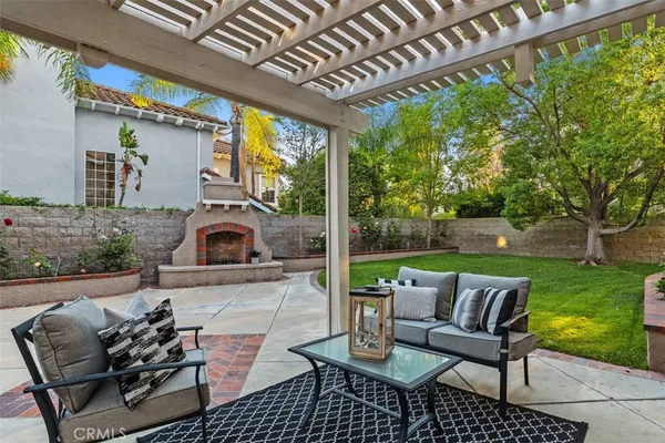 a view of a patio with couches chairs and a table and chairs