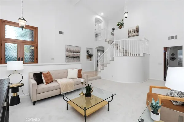 a living room with furniture and a table