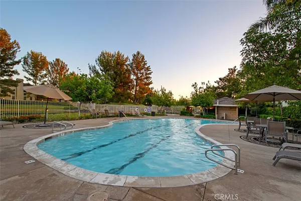 a view of a backyard with sitting area