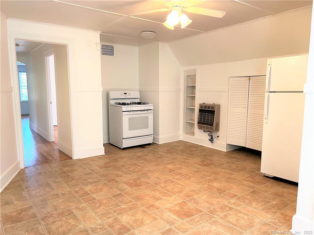 122 Derby Avenue, Unit 3 Seymour, CT 06483 - Photo 2 of 8 a view of a kitchen with a stove cabinets and a refrigerator