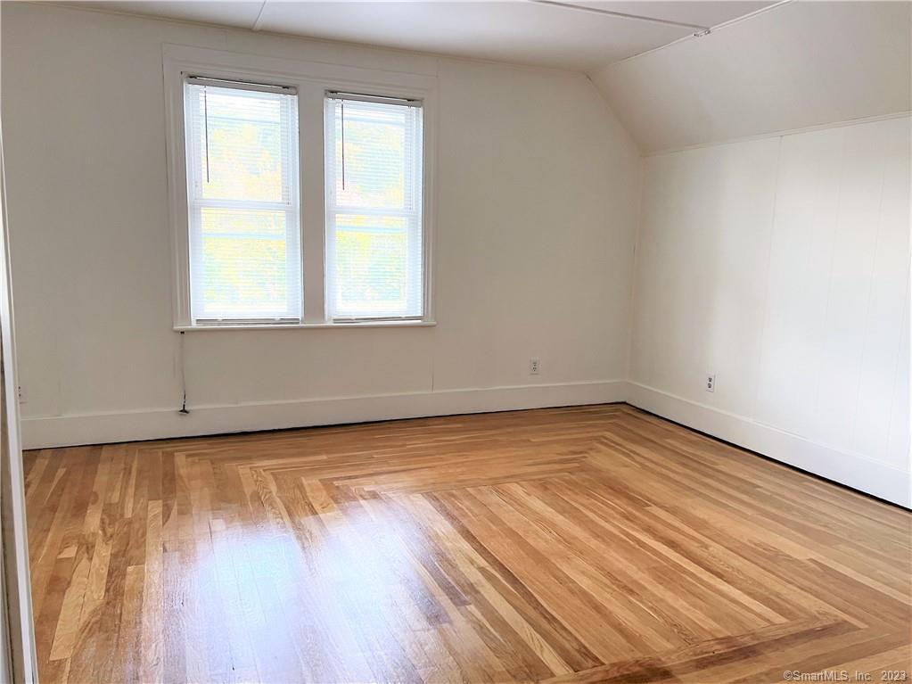 122 Derby Avenue, Unit 3 Seymour, CT 06483 - Photo 6 of 8 a view of a room with wooden floor and window