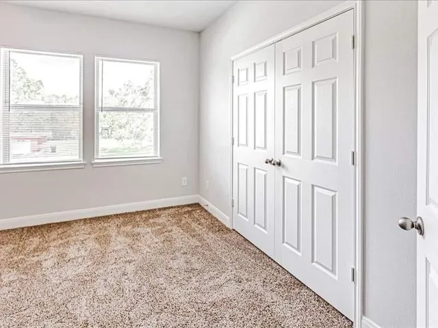 an empty room with windows