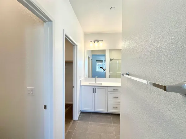 a bathroom with a sink a mirror and a bathtub