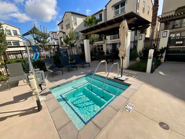 a view of a chairs and table in a patio