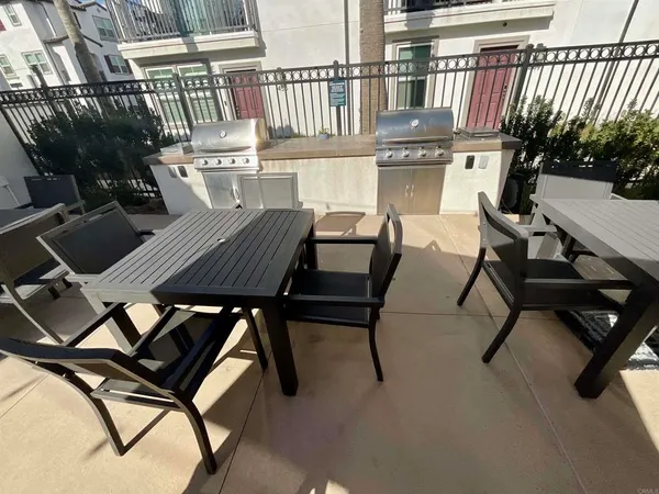 a view of a chairs and table in patio