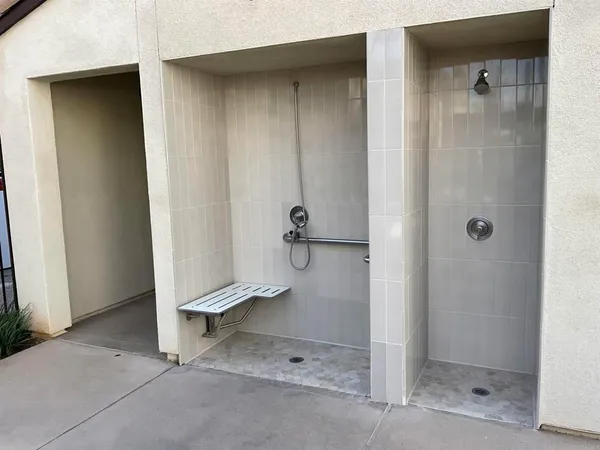 a bathroom with a glass door shower