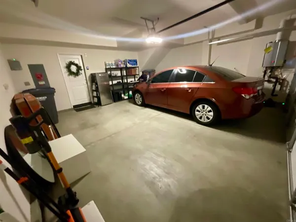 a view of a garage with parked cars