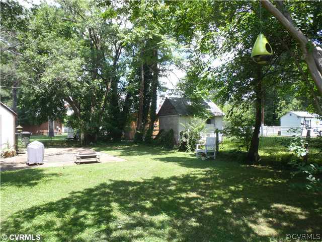 1802 Newman Road Richmond, VA 23231 - Photo 3 of 11 Exterior Back - Large yard with great plantings!